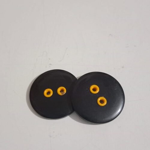 Botón negro y amarillo grande precio 500 unidad